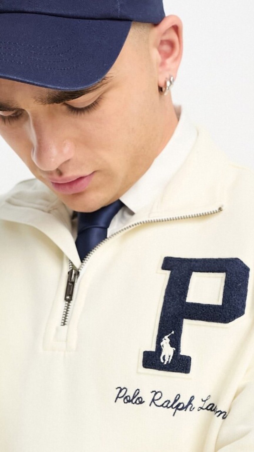 Person wearing a Polo Ralph Lauren jacket with a large 'P' logo.