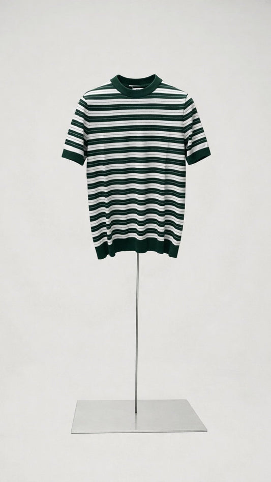 Green and white striped dress on a mannequin against a white background