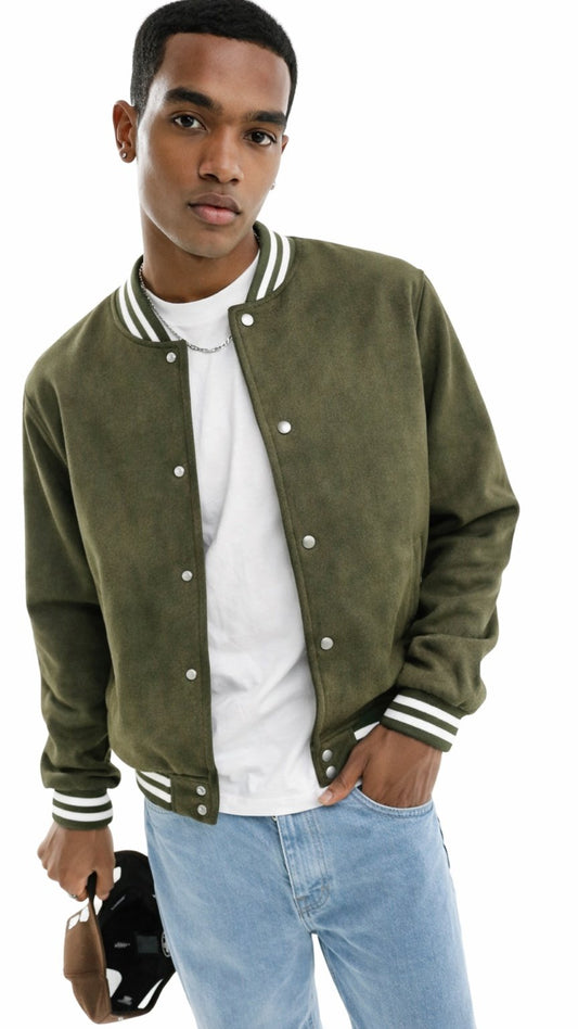Man wearing a green varsity jacket with white accents on a white background
