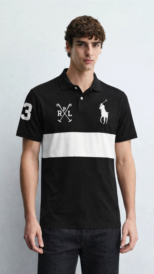 Man wearing a black and white polo shirt with a logo on a light gray background