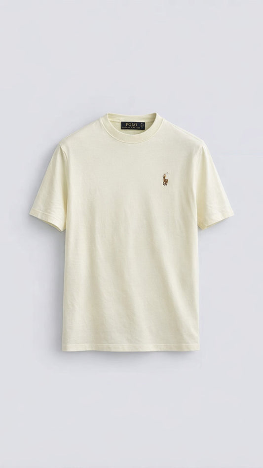 Beige t-shirt with a small logo on a light gray background
