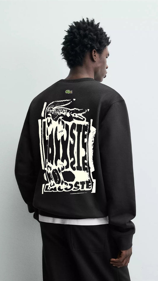 Person wearing a black sweatshirt with white text and graphics on the back against a light gray background