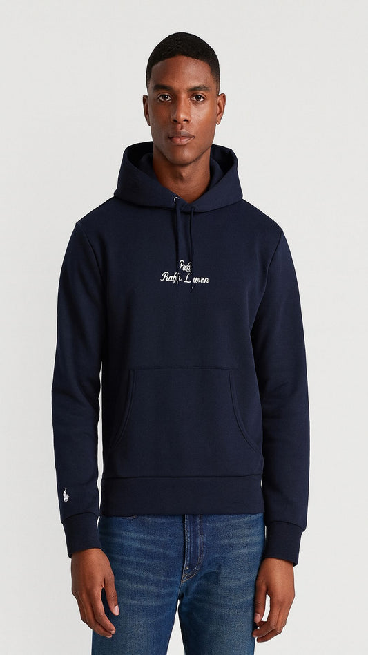 Man wearing a navy hoodie with a logo on a white background