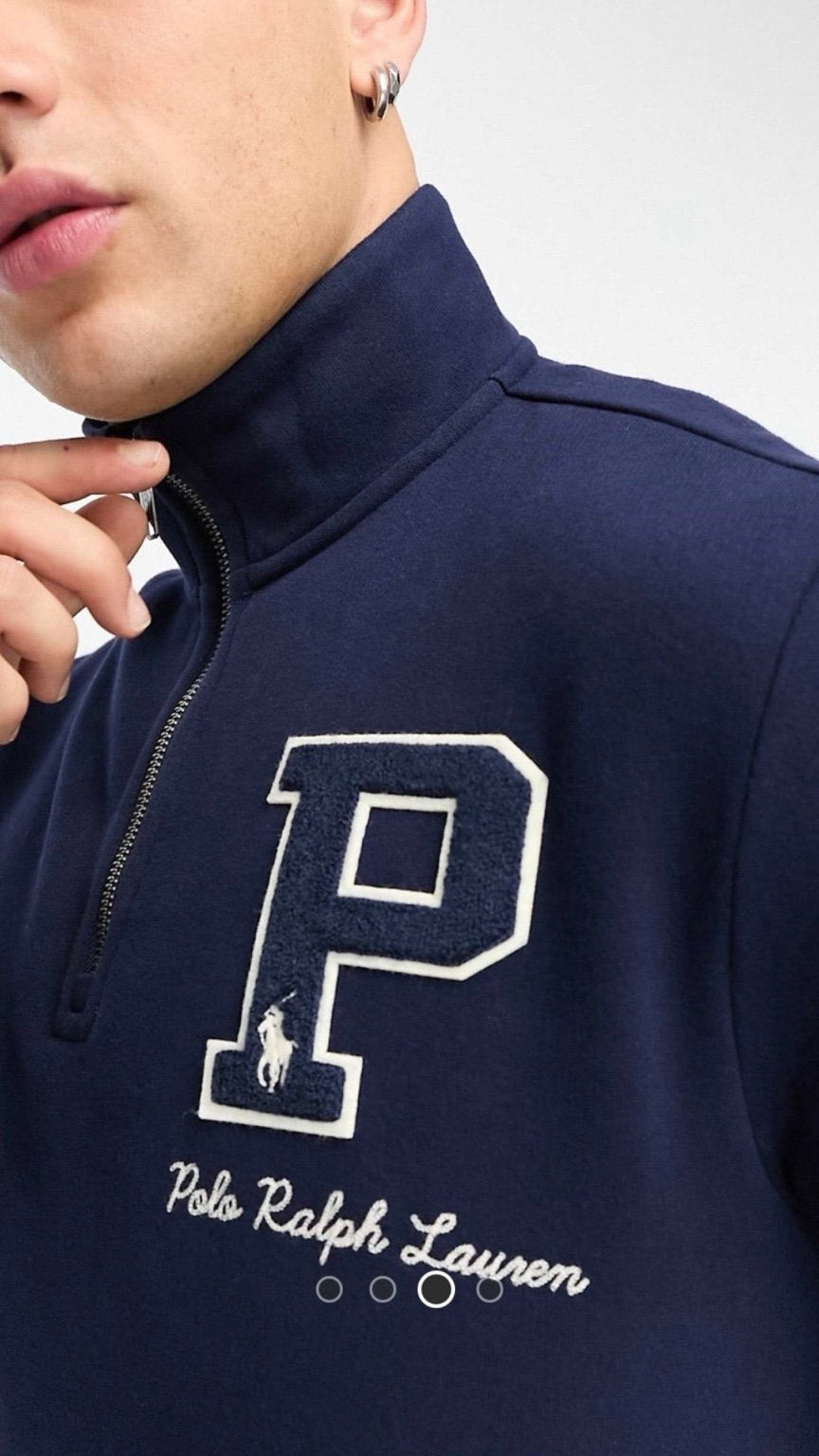 Navy blue sweatshirt with a large white 'P' logo and 'Polo Ralph Lauren' text on a plain background.