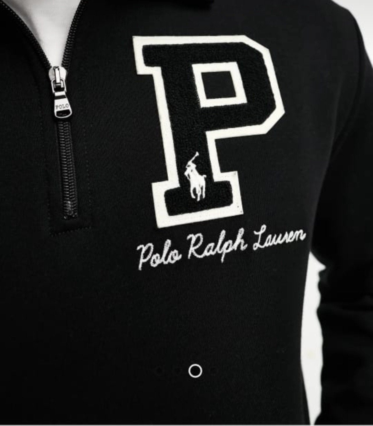 Black quarter-zip sweatshirt with Polo Ralph Lauren logo on a white background