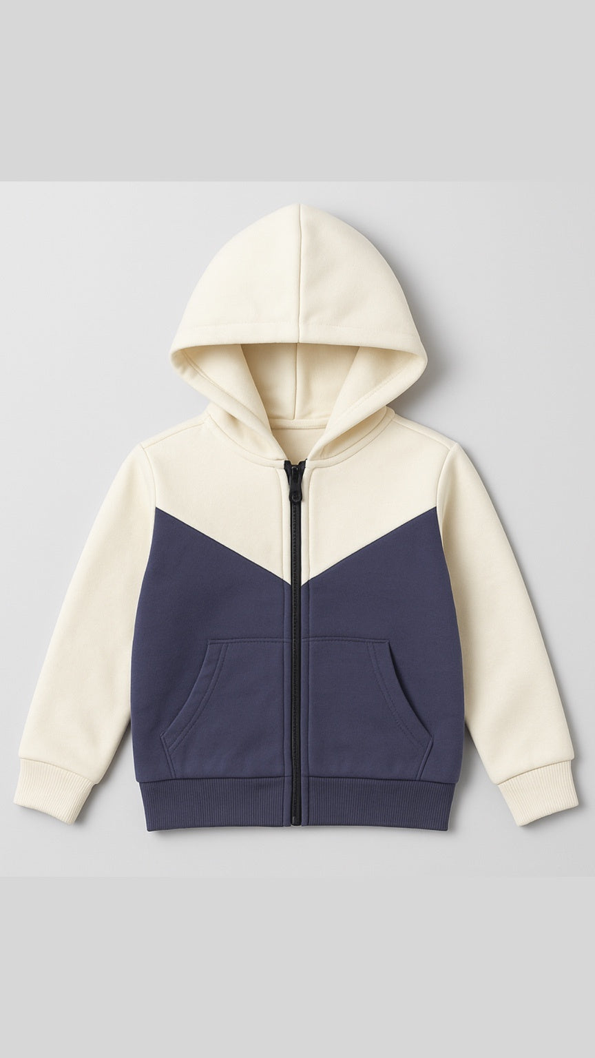 Two-tone hoodie with cream and navy design on a light gray background