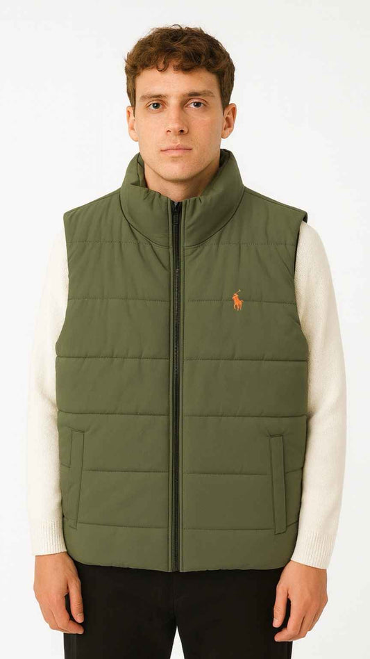 Man wearing a green puffer vest over a white shirt on a white background