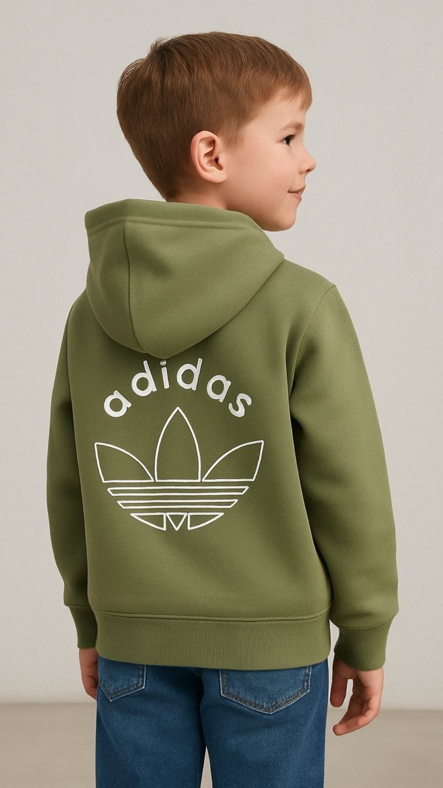 Child wearing a green Adidas hoodie with a white logo on the back.