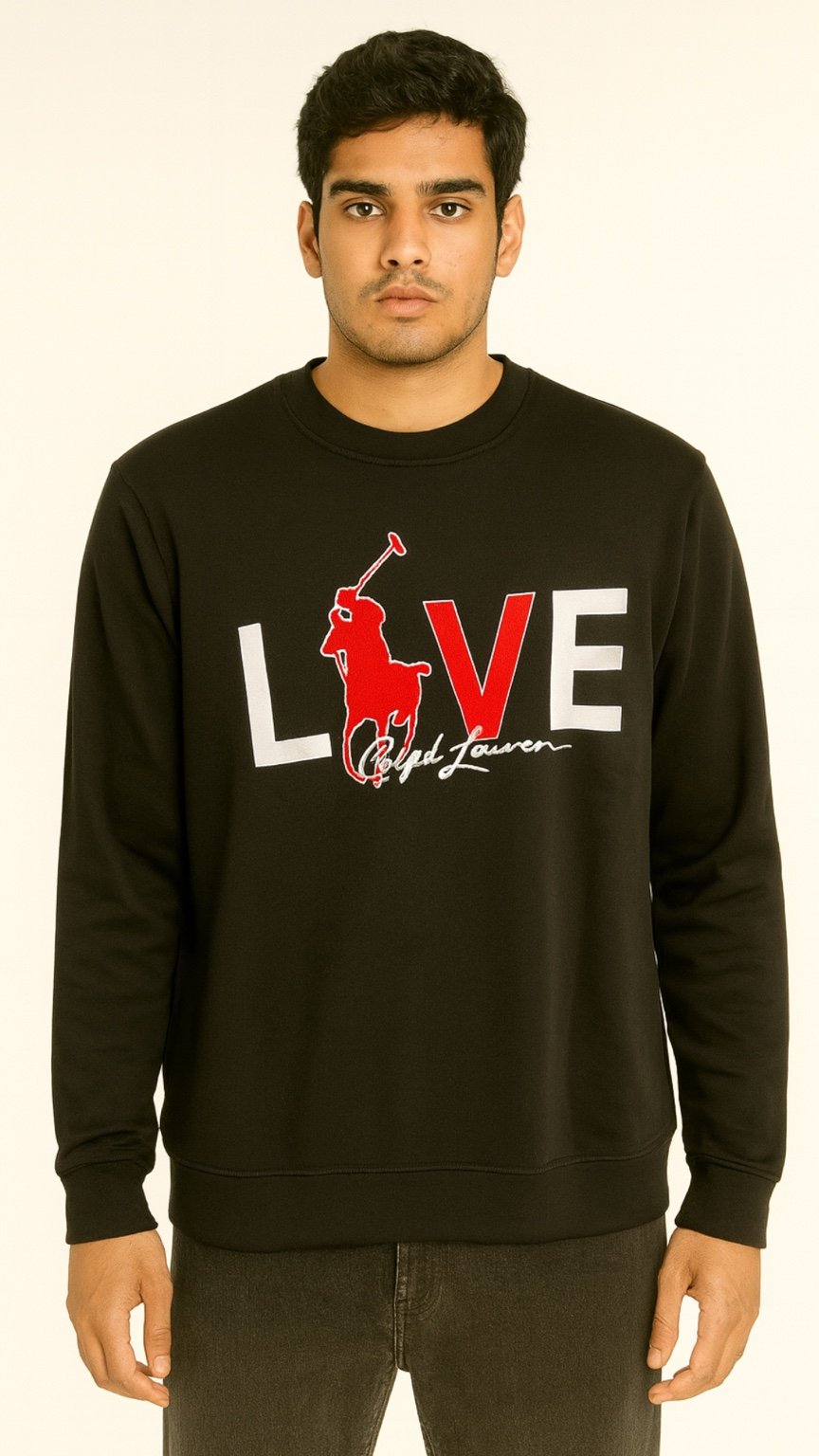 Man wearing a black sweatshirt with a graphic design on a beige background