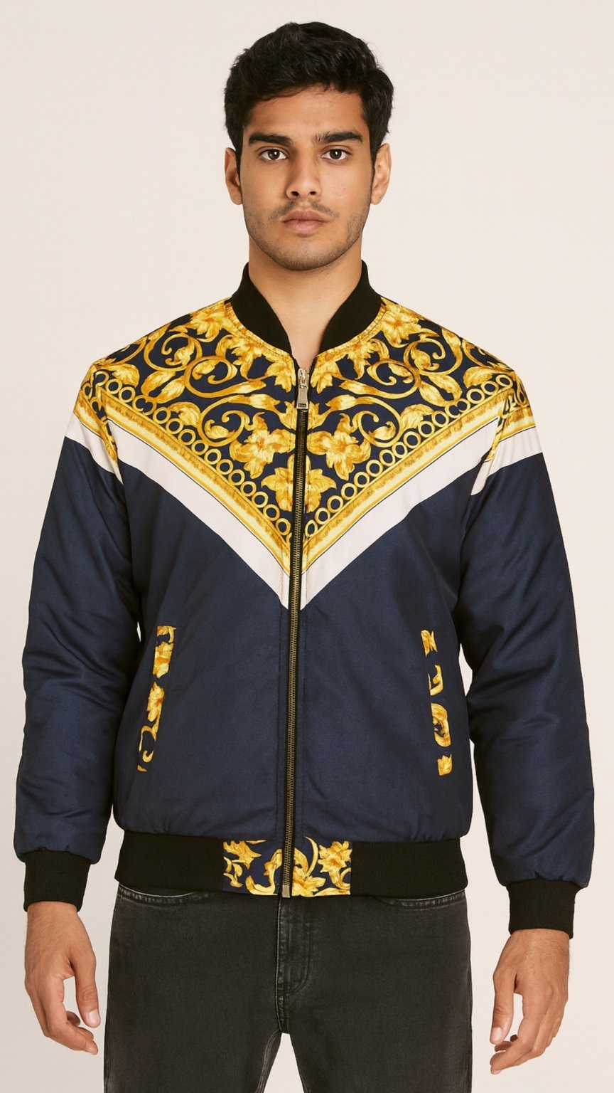 Man wearing a blue and gold patterned jacket on a beige background
