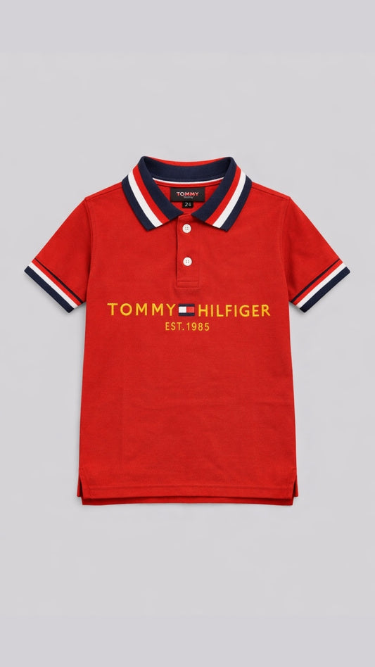 Red Tommy Hilfiger polo shirt on a gray background