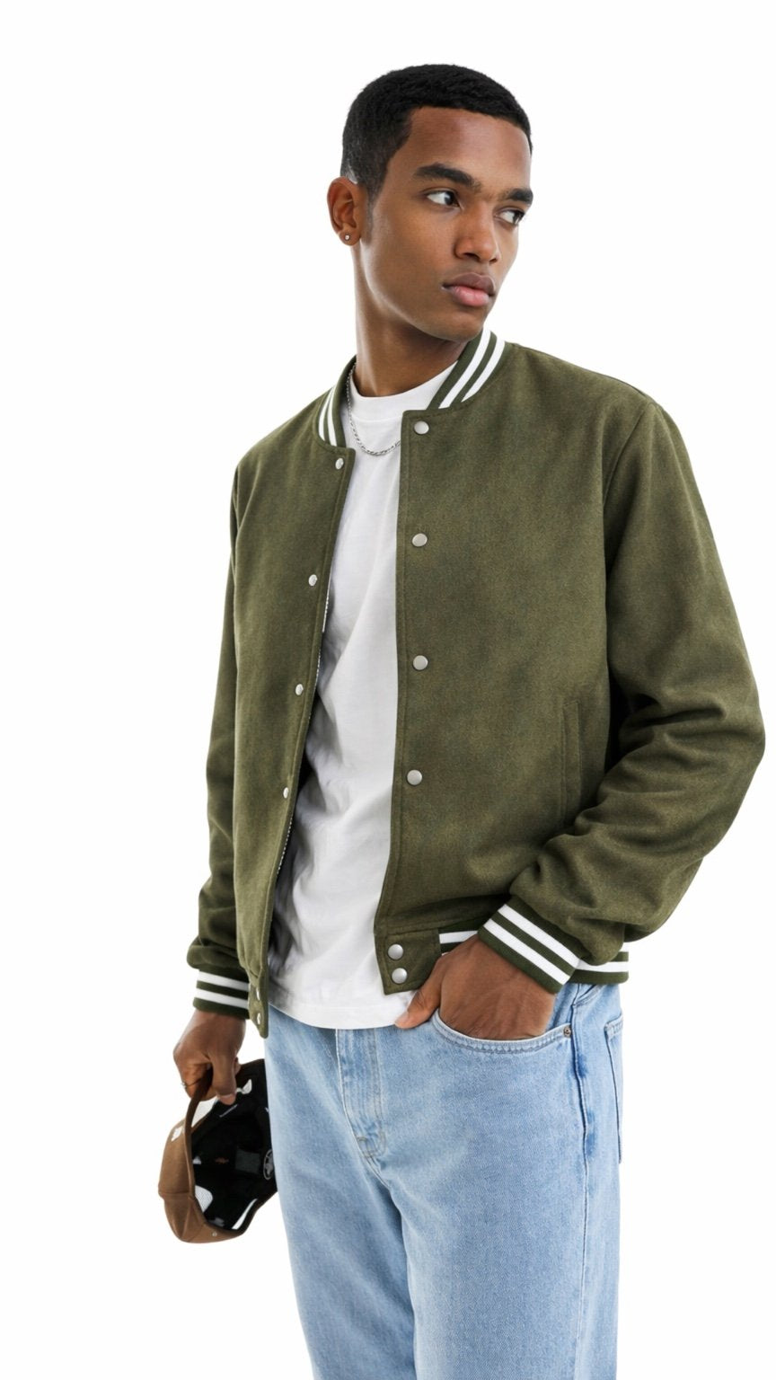 Man wearing a green varsity jacket with white trim on a white background