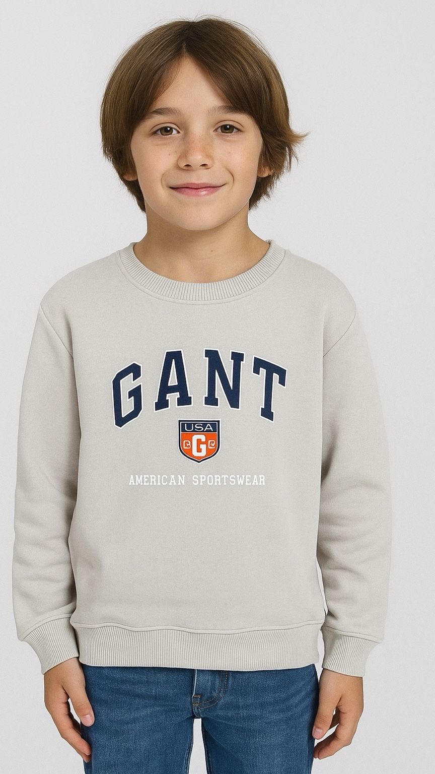 Child wearing a gray Gant sweatshirt on a white background