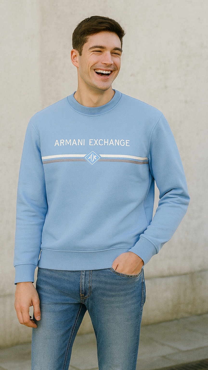 Man wearing a light blue Armani Exchange sweatshirt against a neutral background