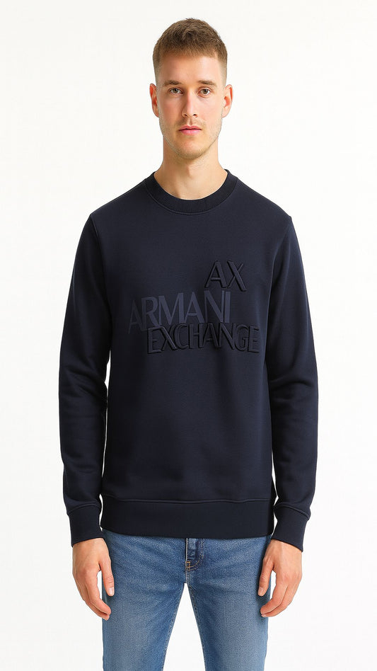 Man wearing a navy Armani Exchange sweatshirt on a white background