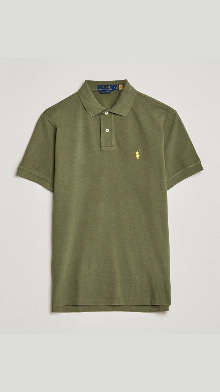 Green polo shirt with a logo on a white background