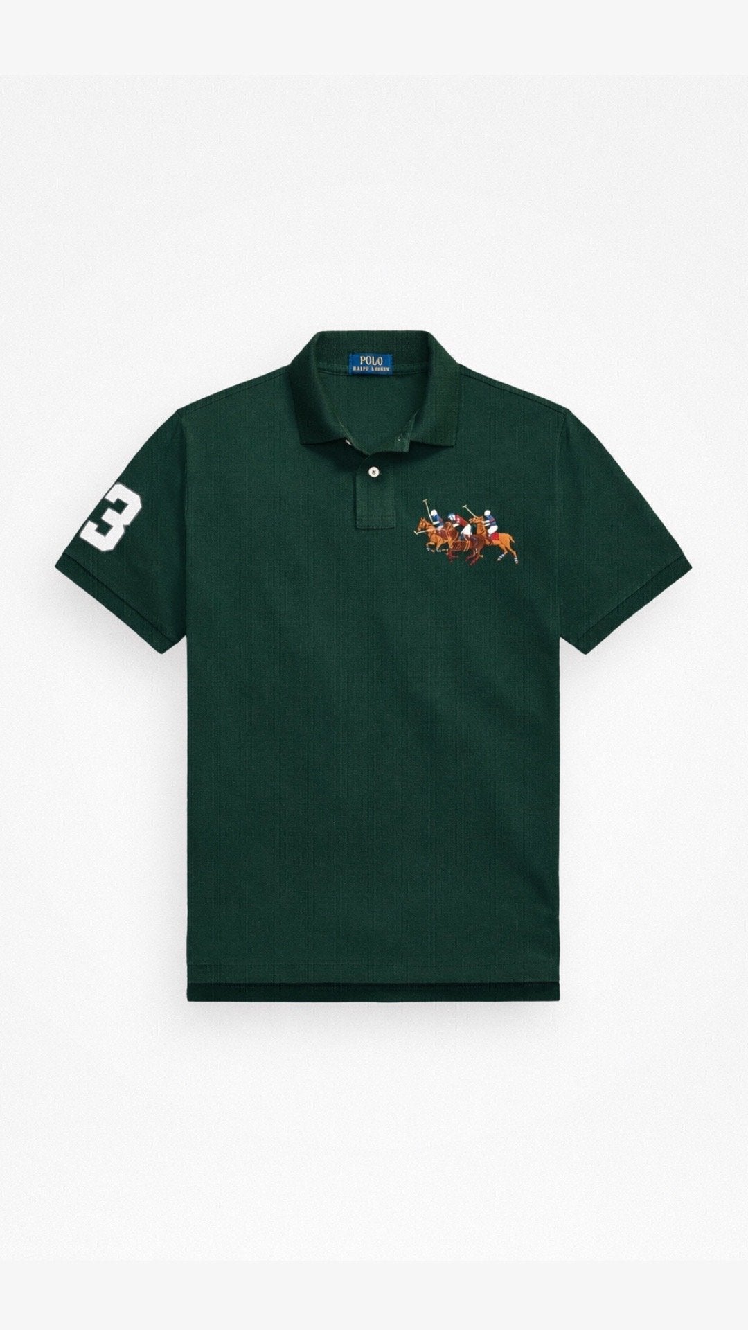 Green polo shirt with a small embroidered design on a white background