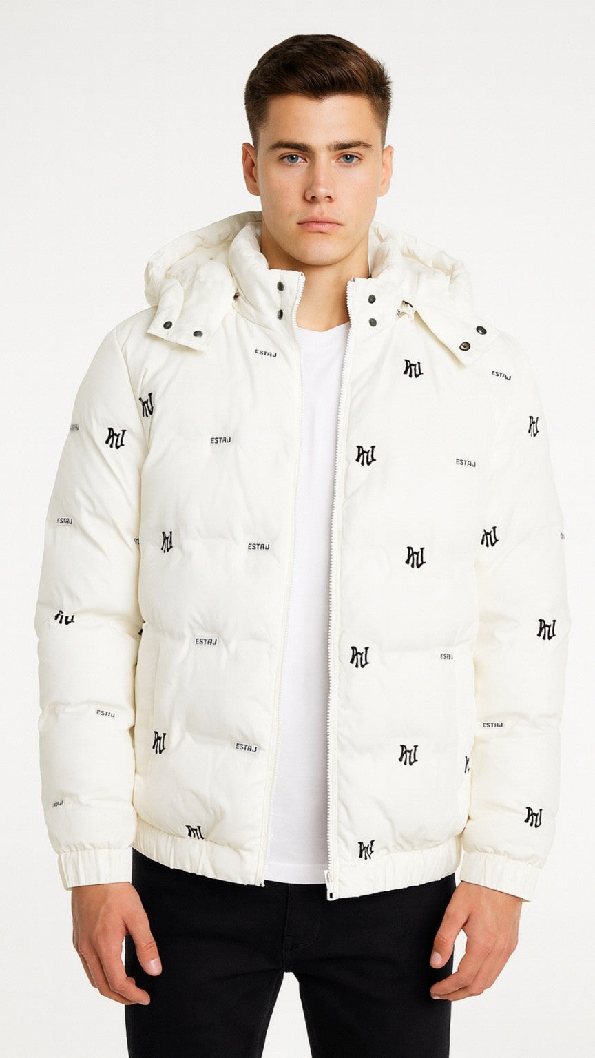 Man wearing a white puffer jacket with black patterns on a white background