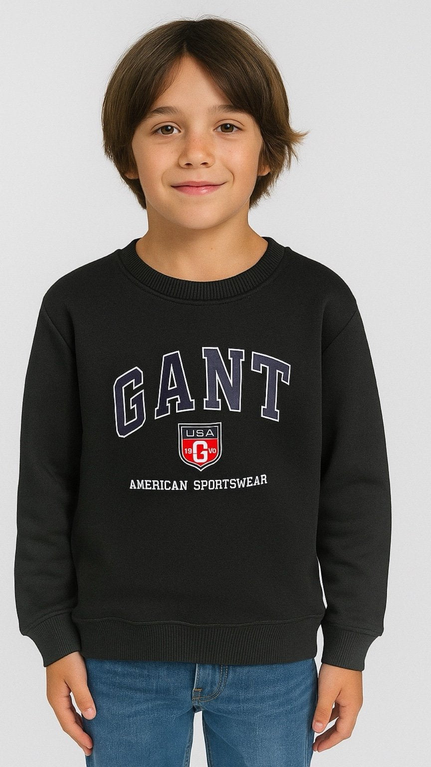 Child wearing a black Gant sweatshirt with a white background