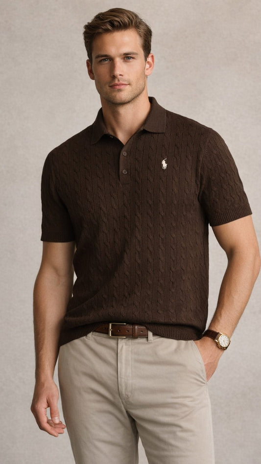 Man wearing a brown polo shirt with a logo, beige pants, and a watch on a neutral background