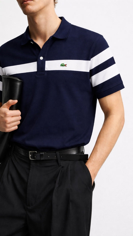 Navy polo shirt with white stripes and a visible brand logo, worn by a person.