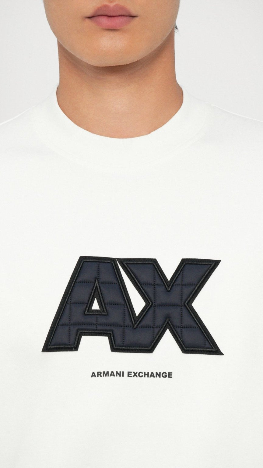 White t-shirt with Armani Exchange logo on a white background