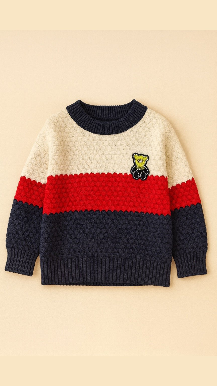 Color-blocked sweater with a teddy bear design on a beige background