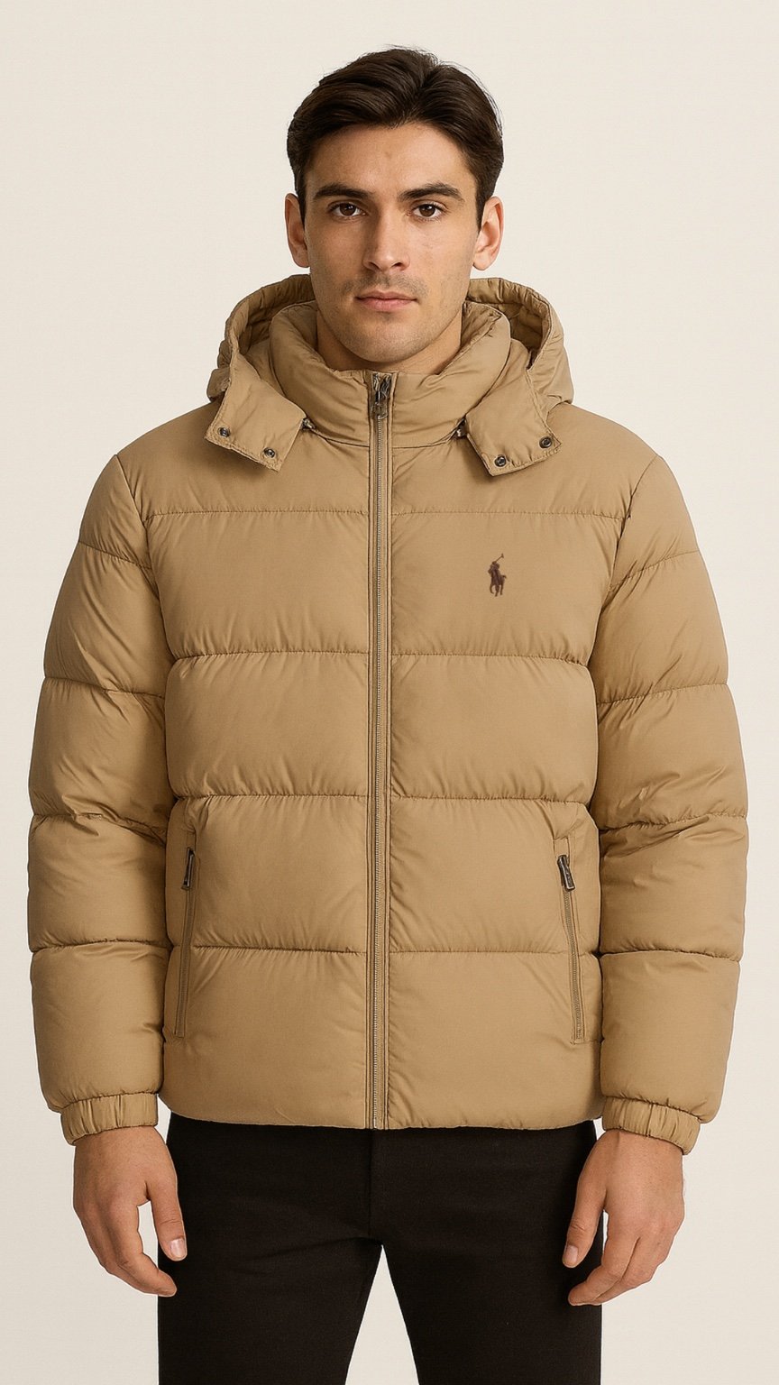 Man wearing a beige puffer jacket on a beige background