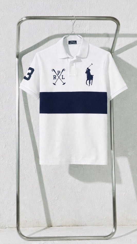 White polo shirt with navy blue stripe and brand logo on a metal rack against a light gray background