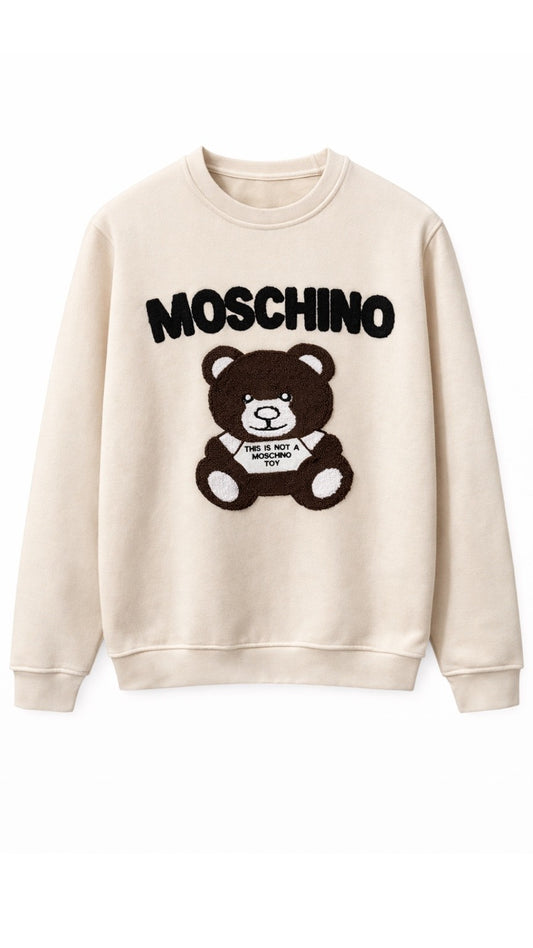 Beige sweatshirt with Moschino logo and bear graphic on a white background