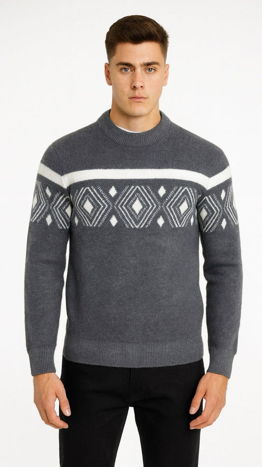 Man wearing a gray sweater with a patterned design on a white background