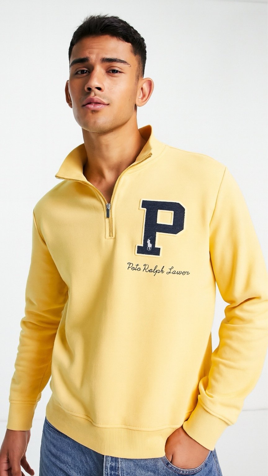 Man wearing a yellow Polo Ralph Lauren sweatshirt with a blue 'P' logo on a white background
