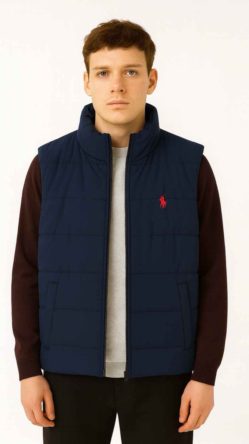 Man wearing a navy blue vest with a red logo on a white background